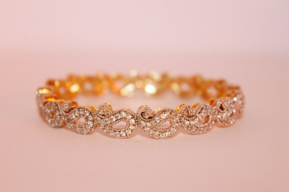 Stacked gold bangles